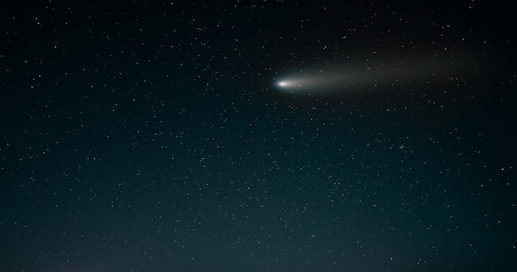 comet flying through the starry night sky. Comet free photo, comet high quality photo, comet stock p...