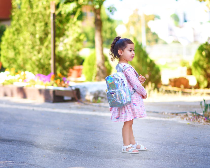 Cute child heading off for her first day of Pre-K in a round up of the best first day of pre-k capti...