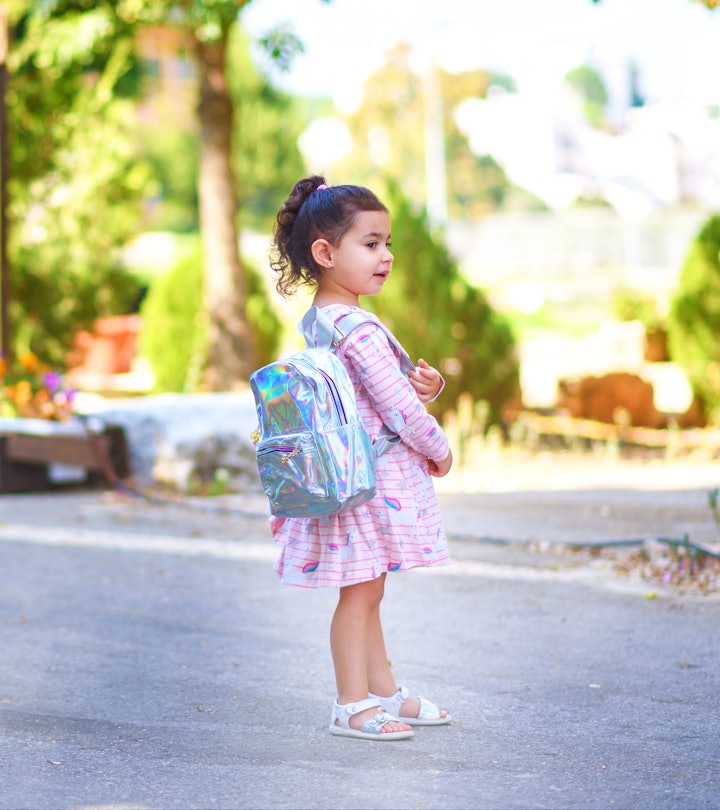 Cute child heading off for her first day of Pre-K in a round up of the best first day of pre-k capti...