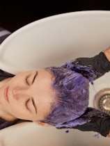 Shampoos to tone gray hair often have a purple hue. 