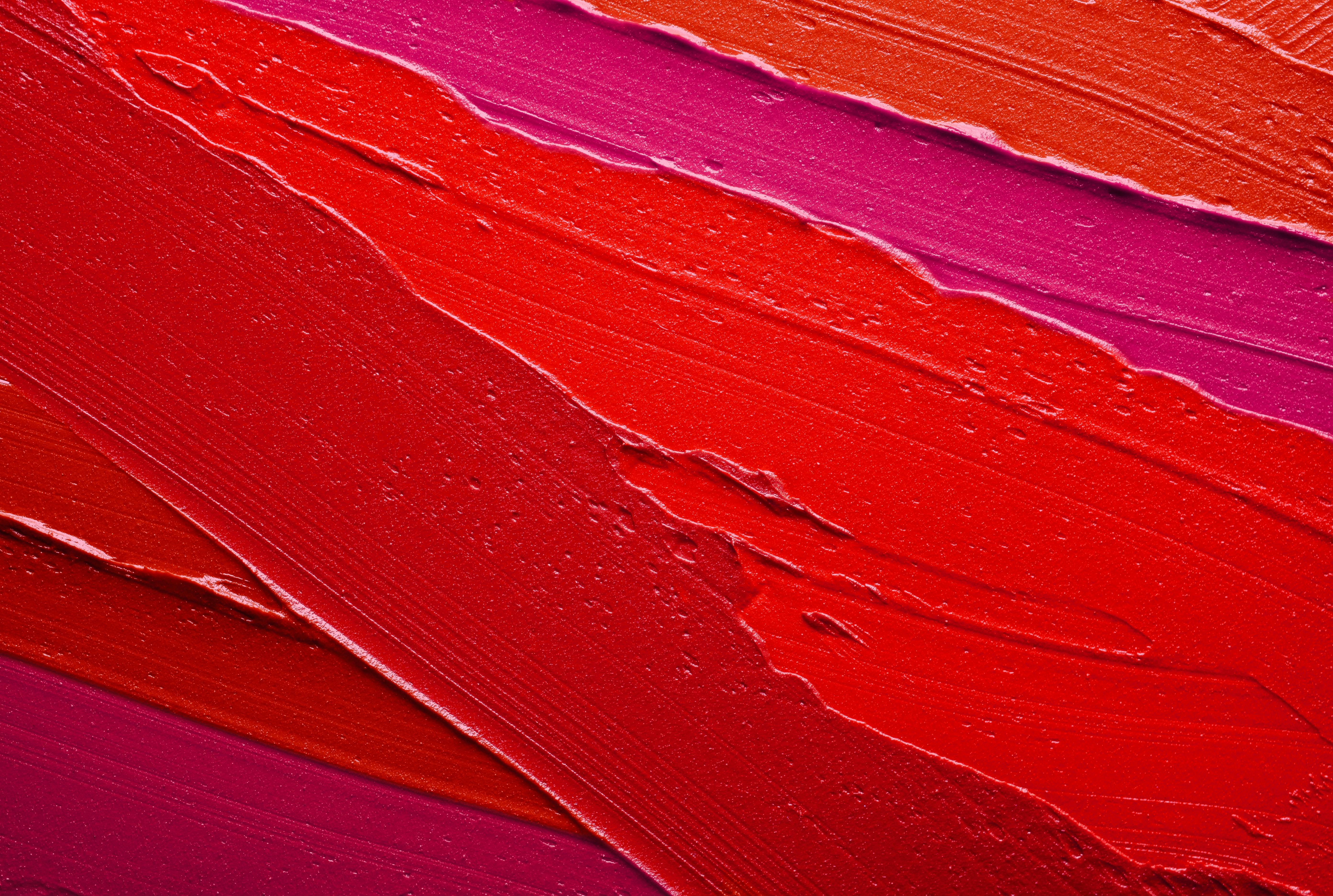 Lip gloss pink red smudge background
