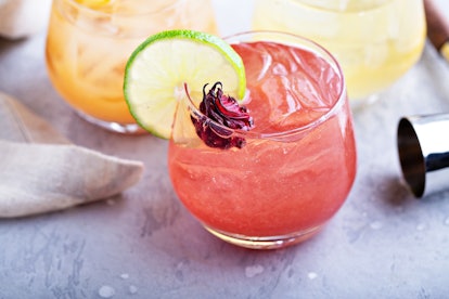 summer cocktails with apples, oranges and dried hibiscus