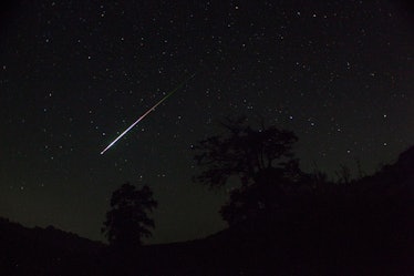Meteor. Perseid meteor shower. Night sky stars and meteors