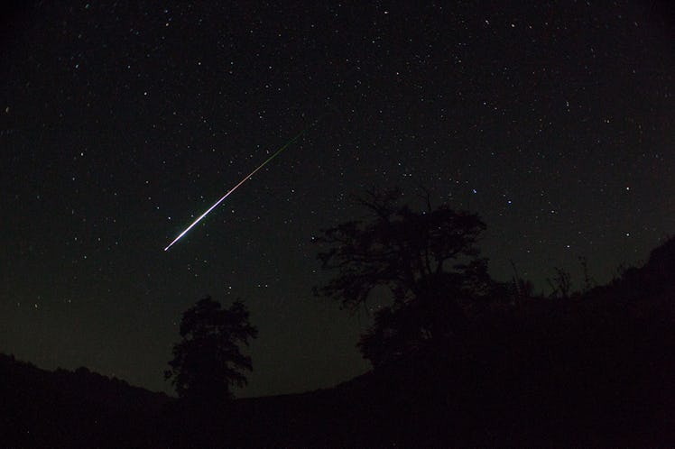Meteor. Perseid meteor shower. Night sky stars and meteors