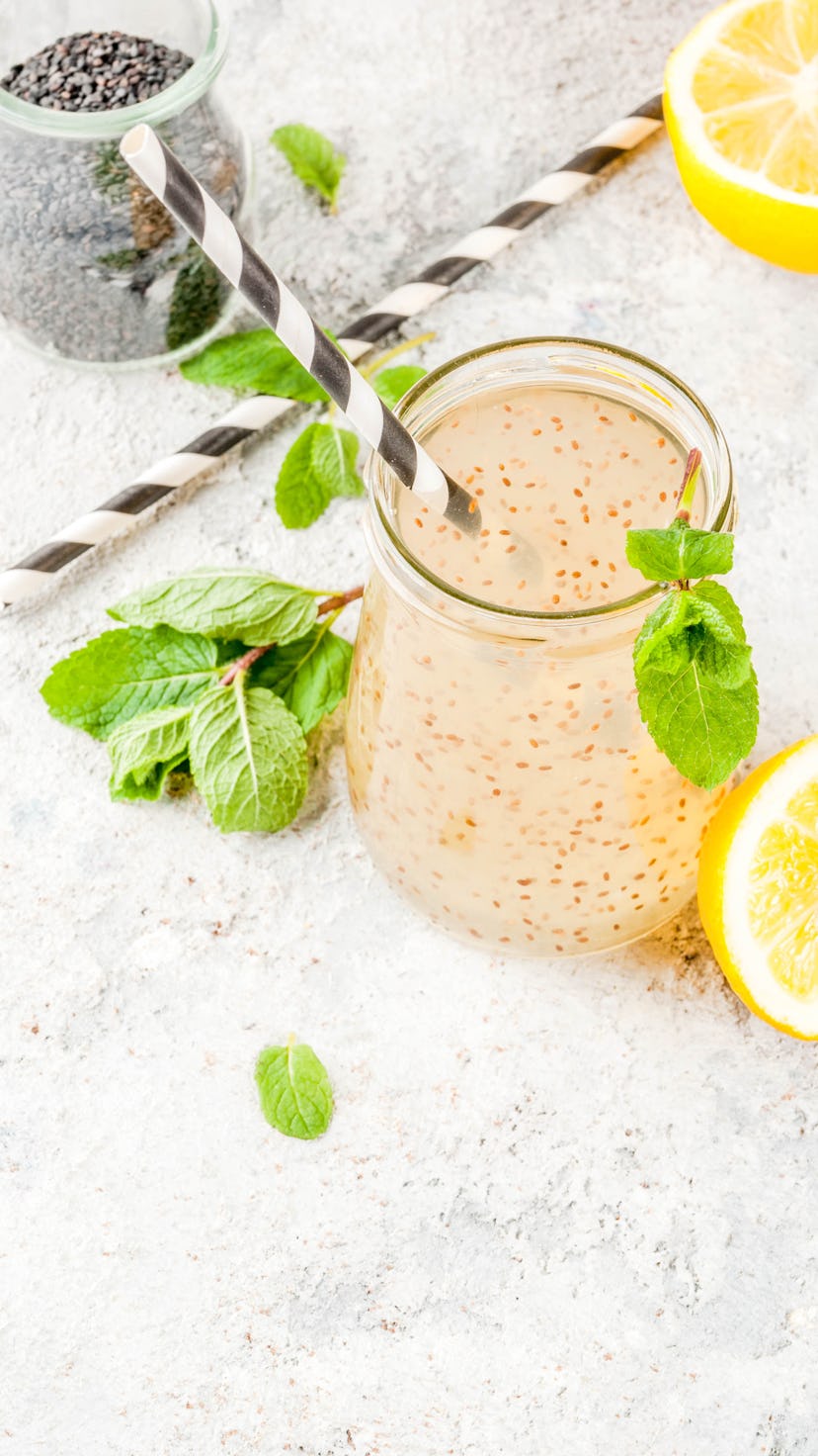 Natural energy drink, Chia fresca, infused water or lemonade on grey stone table copy space