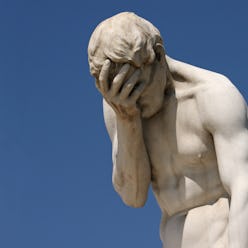 Facepalm - A statue with its head in its hand