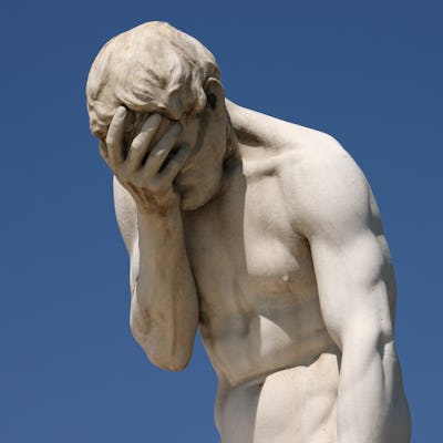 Facepalm - A statue with its head in its hand