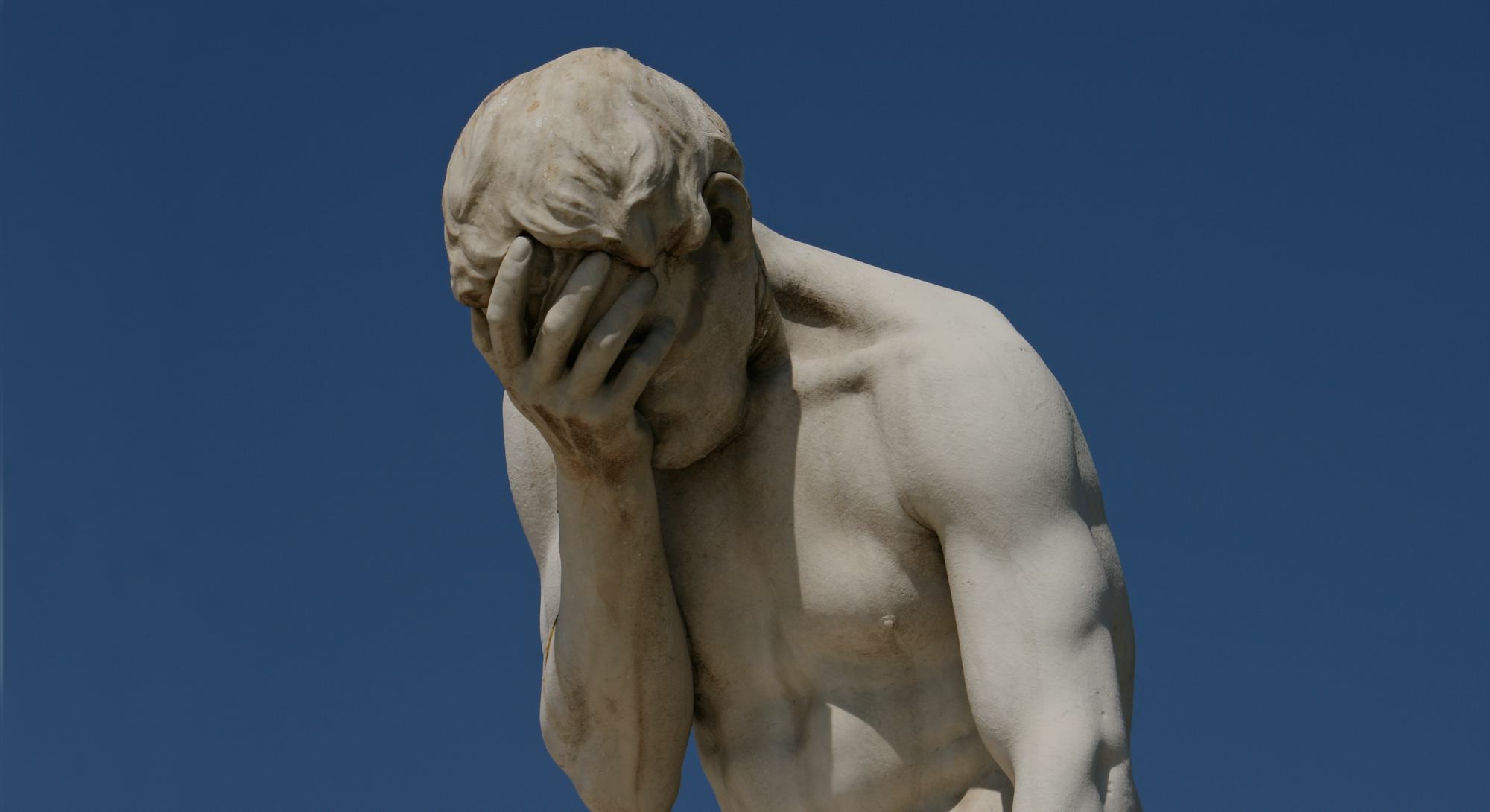 Facepalm - A statue with its head in its hand