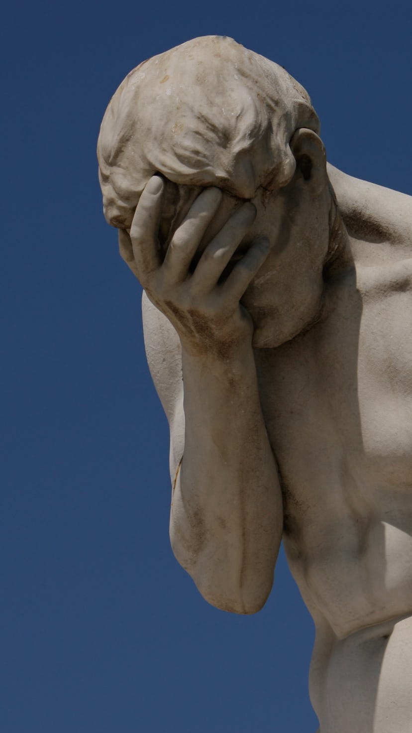 Facepalm - A statue with its head in its hand