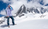 Climber breathing with mini portable oxygen cylinder to avoid and treat High Altitude Sickness sympt...