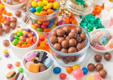 Milk chocolate candies in shell with jelly sugar gums and liquorice allsorts and fruit sherbet candi...