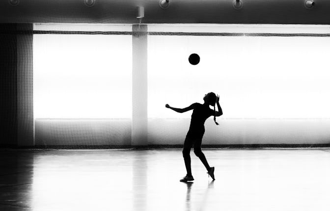 Girl playing volleyball in the sports club