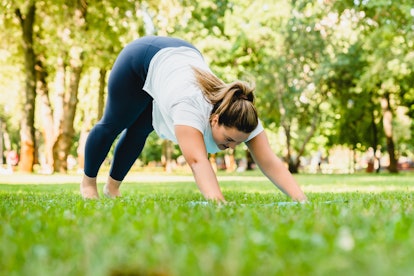 The downward facing dog yoga move can relieve tightness in your back.