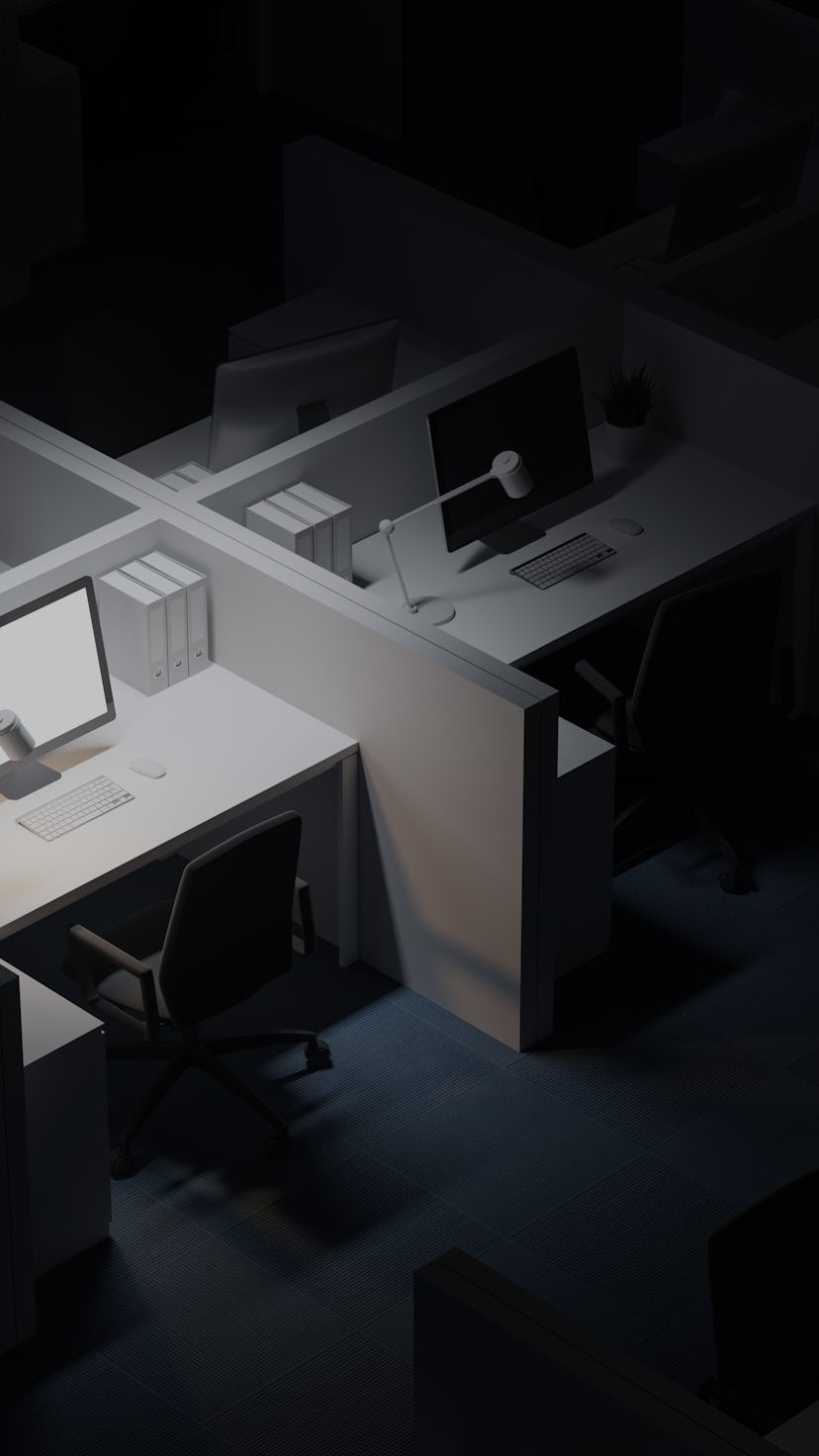 Top view of white office cubicle with mock up computer screen standing in modern office at night. Co...