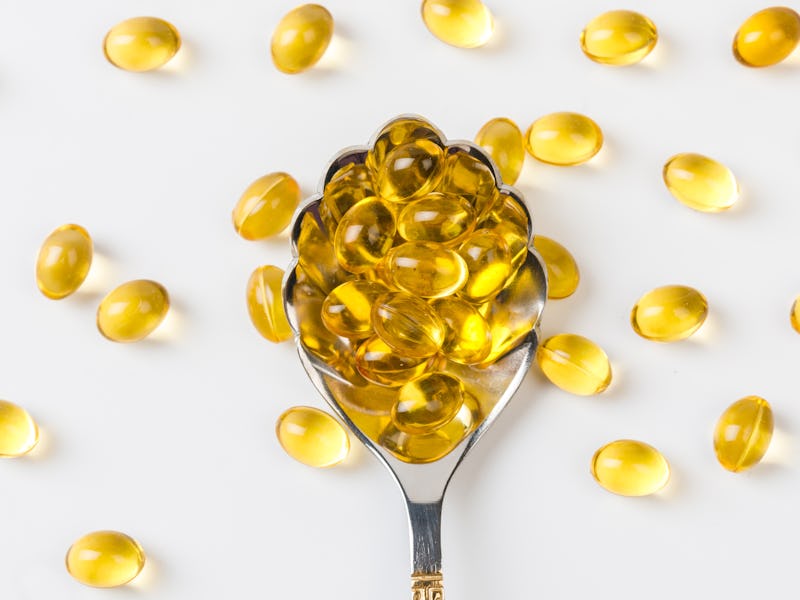 Close up of oil filled capsules suitable for: fish oil, omega 3, omega 6, omega 9, vitamin A, vita...
