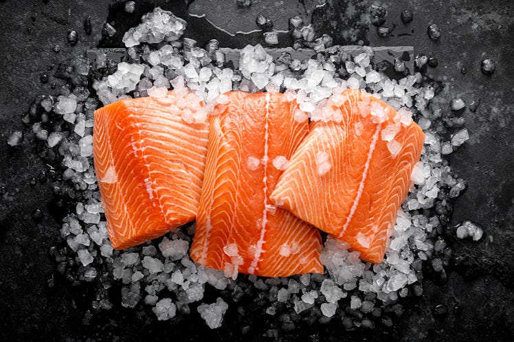 Salmon fillet. Slices of fresh raw salmon fish on ice