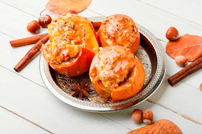 Persimmon stuffed with oatmeal with caramel sauce.Baked persimmon.Autumn fruit dessert