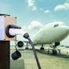 electric aircraft charger station with plug and power cable supply on cargo or airplane parking with...