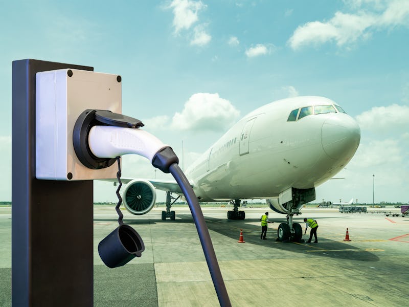 electric aircraft charger station with plug and power cable supply on cargo or airplane parking with...