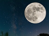 Full moon. Stars. super full moon. Full moon with the background full of stars in the galaxy. Horizo...