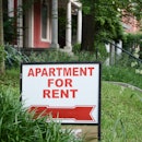 Apartment for rent sign displayed on residental street. Shows demand for housing, rental market, lan...