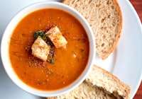 Bowl of hearty roasted tomato and red pepper soup ideal for fall