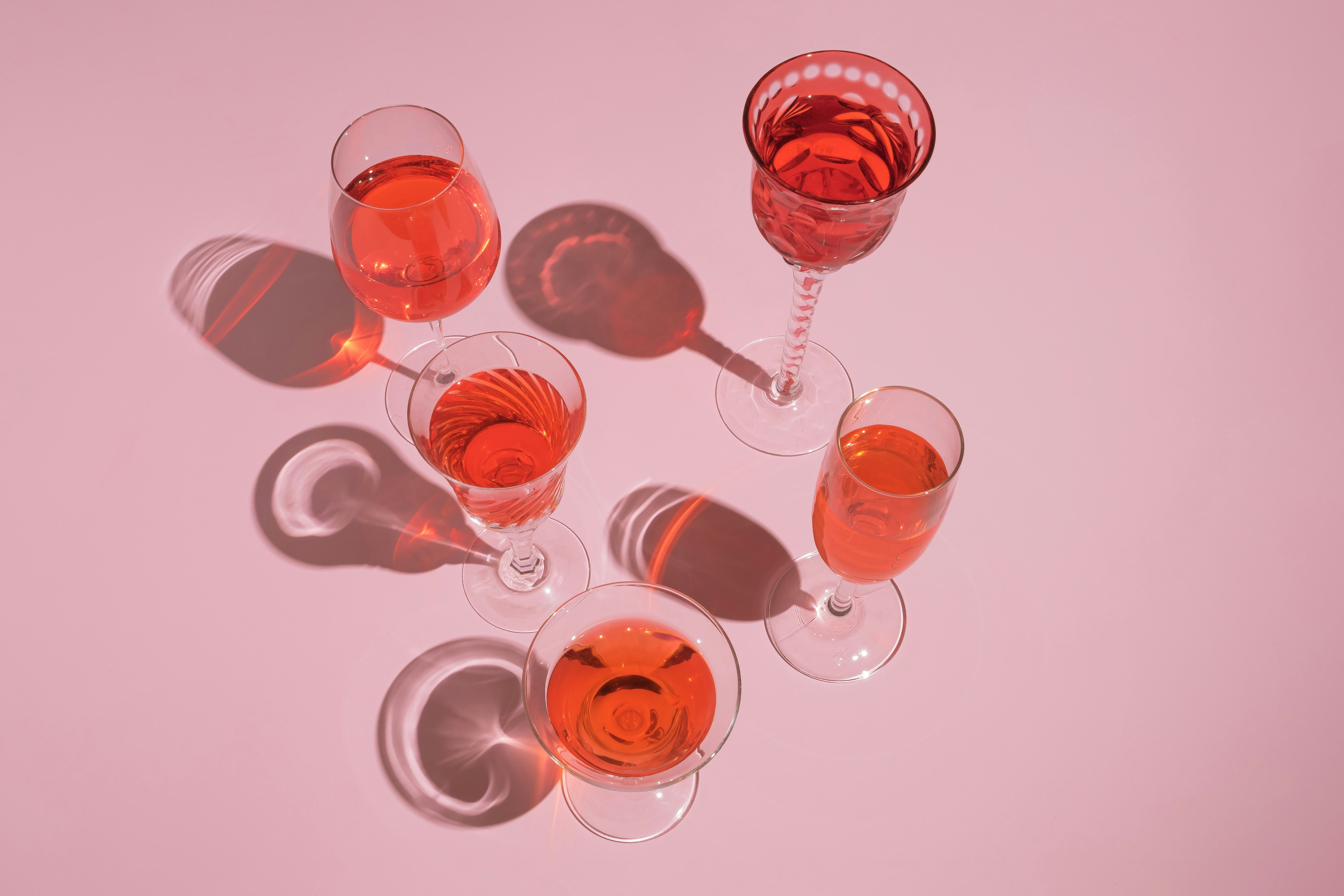 Pastel pink party arrangement with cocktail glasses. Valentine's Day girly theme.