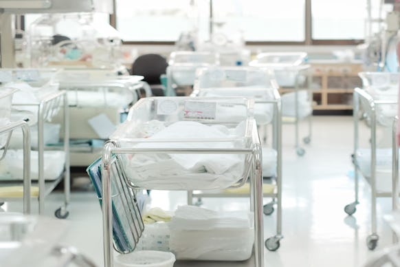 Unidentified new born babies in maternity hospital. Newborn and Childbearing center room in modern h...