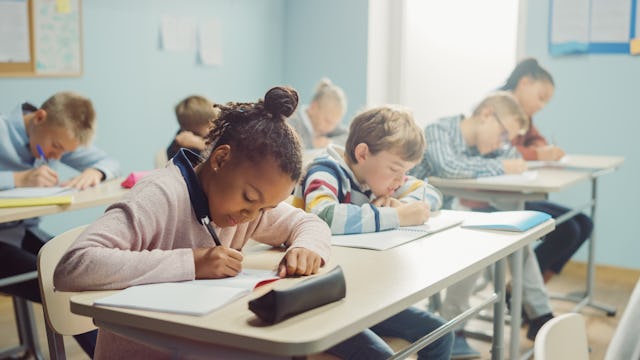 Elementary classroom of children taking a test