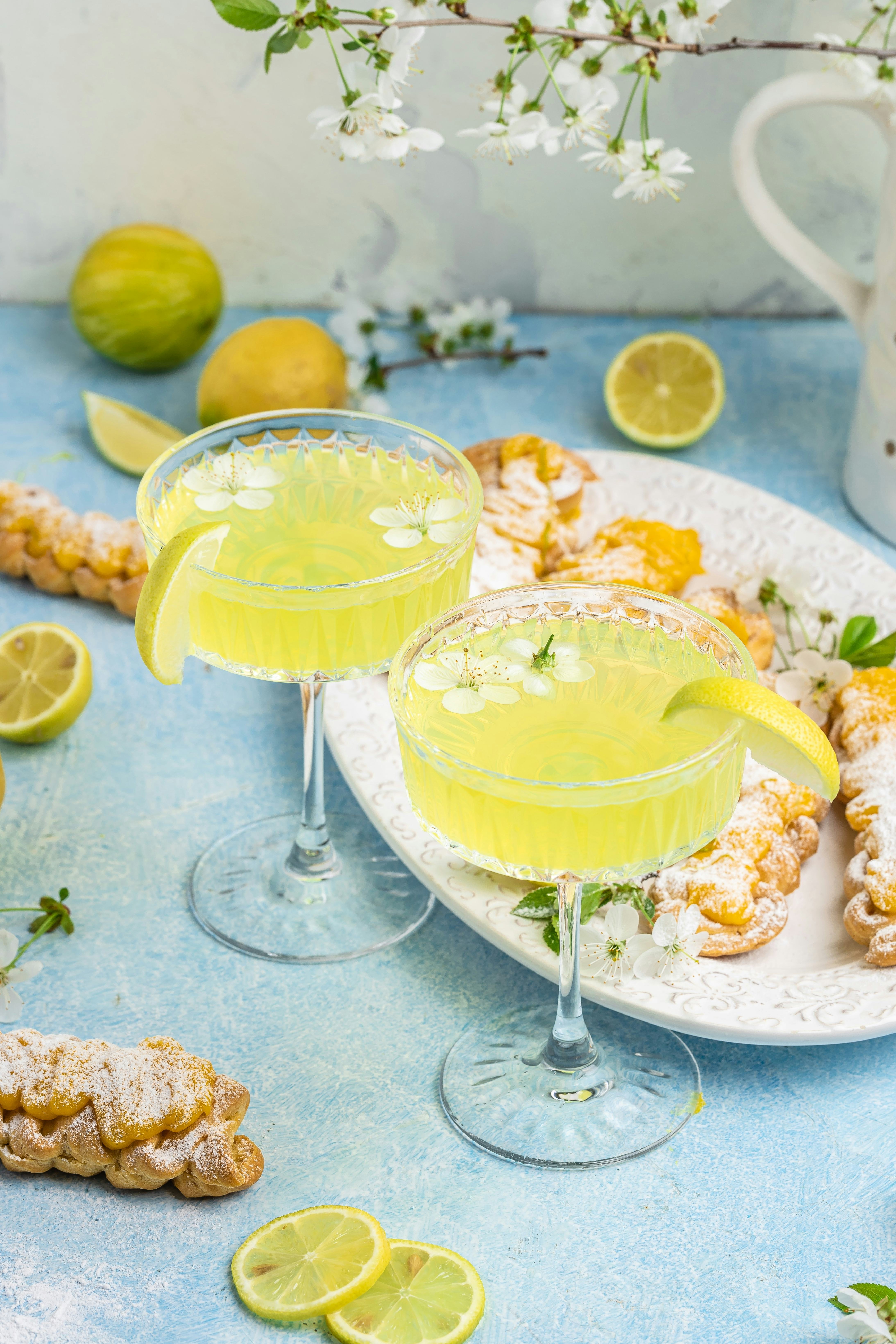 Limoncello. Traditional italian homemade alcoholic drink in glass with pieces of lemon, sweet Italia...