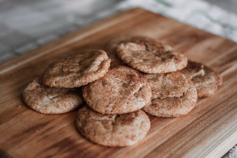 Snickerdoodle cookies made without eggs on a wooden cutting board.