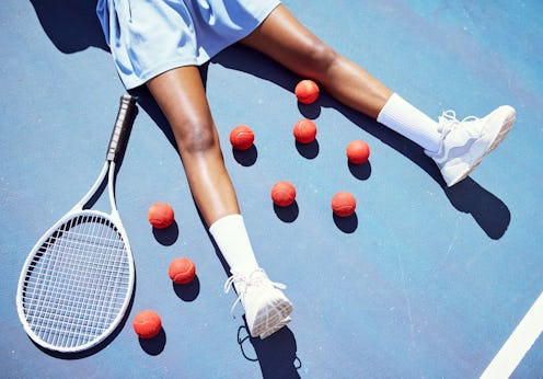 Tennis, tired and woman on a court for sports, fitness training and professional game for cardio. Ex...