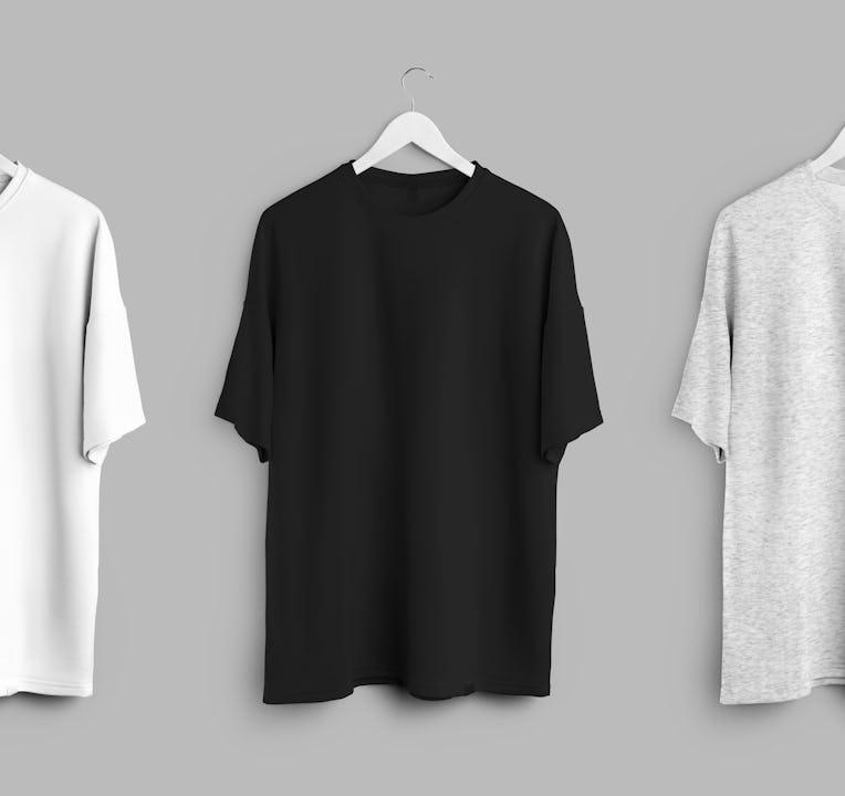 White, black, heather oversized t-shirt mockup, clothes hanging on wooden hanger, front view, isolat...