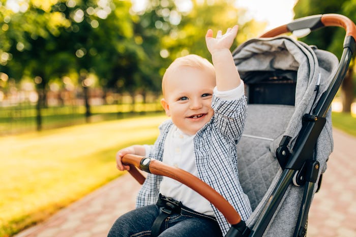 Portrait of smiling happy beautiful little child outdoors on summer day in an article about boy name...