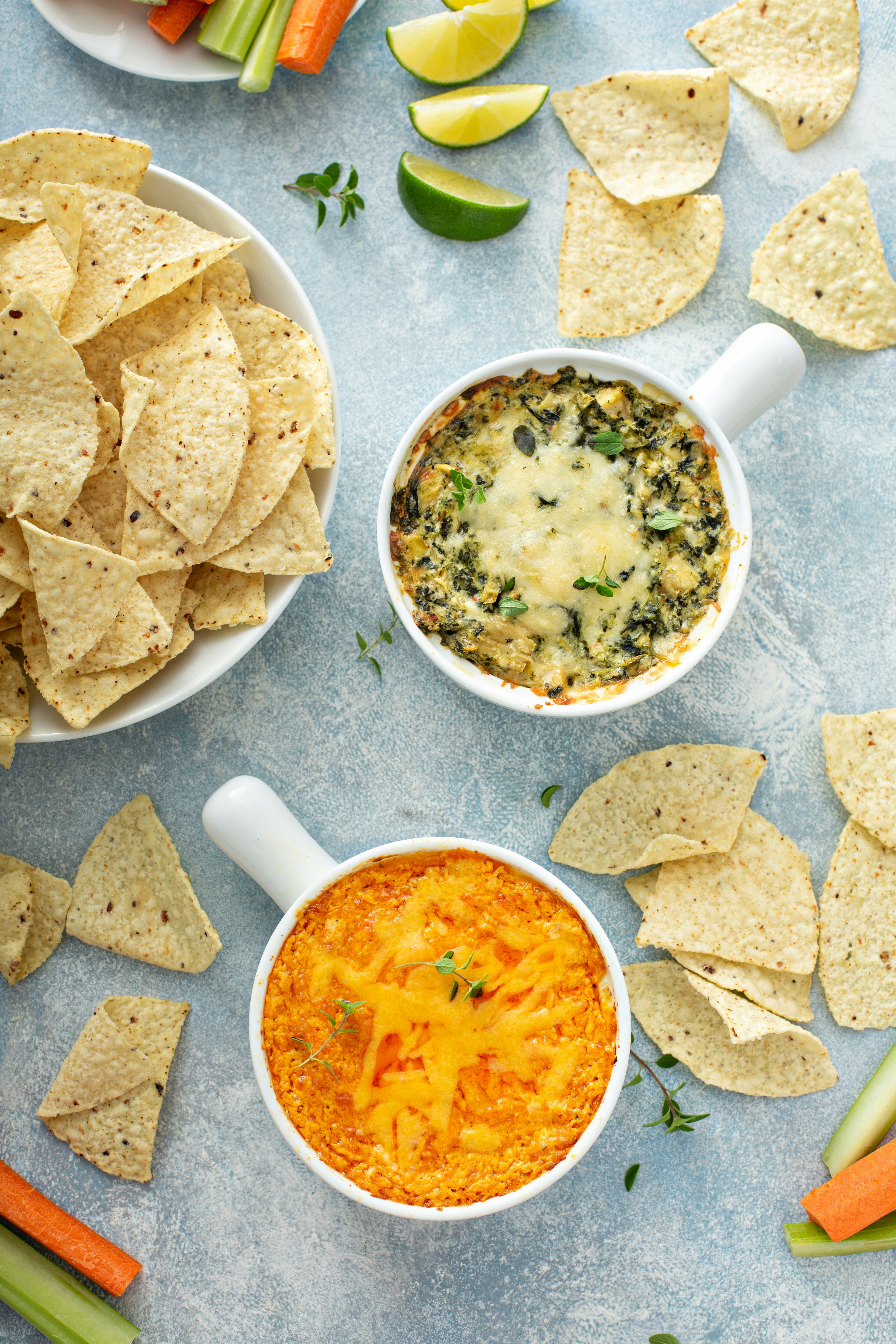 Artichoke spinach and buffalo chicken dips served with tortilla chips, appetizers