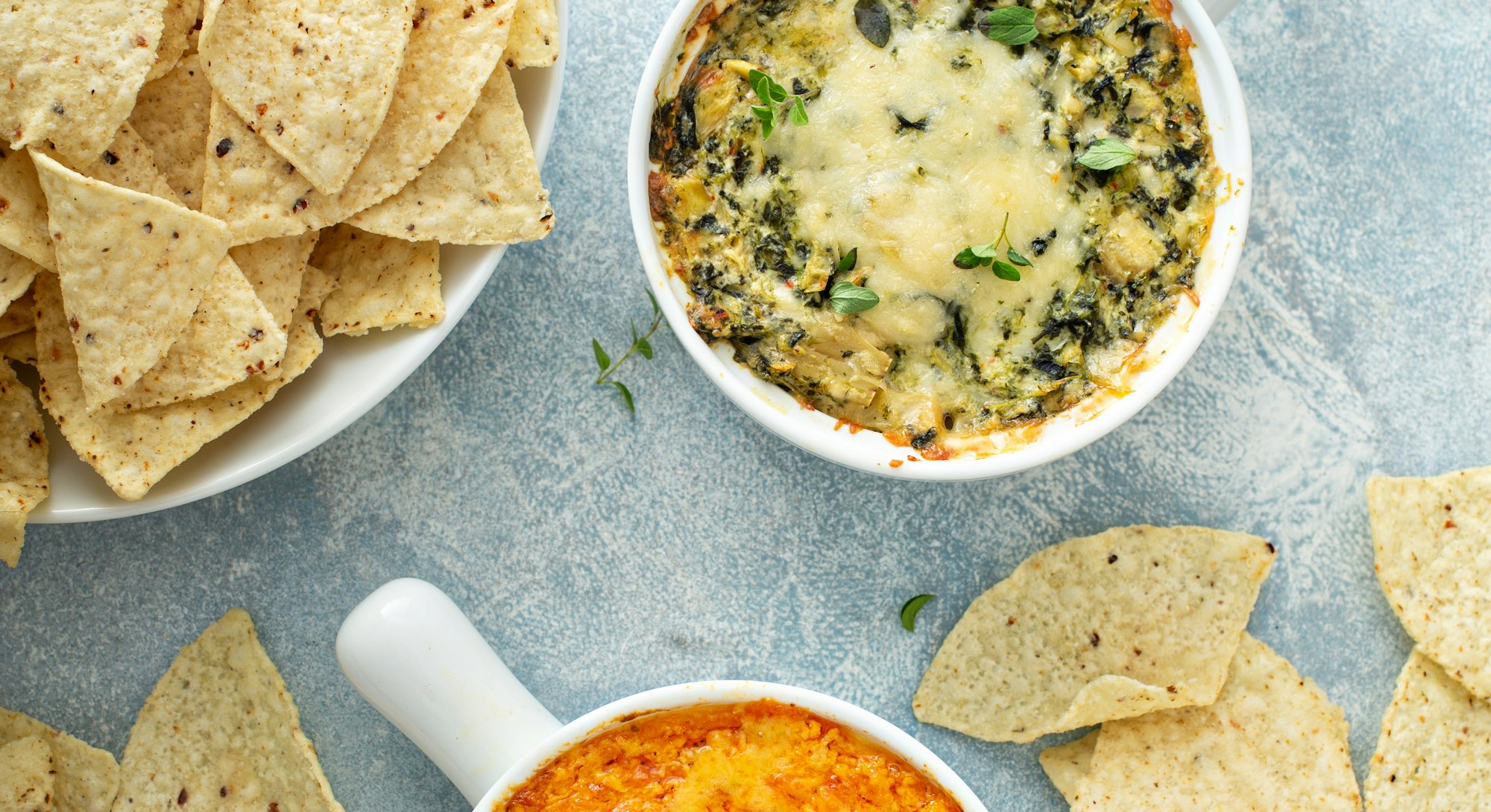 Artichoke spinach and buffalo chicken dips served with tortilla chips, appetizers