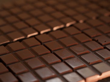 The manufacture of a chocolate bar from raw cocoa ingredients requires many steps, from grinding and...