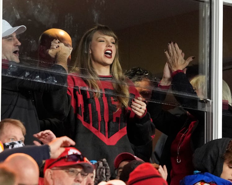 Taylor Swift reacts to a Chiefs touchdown at Arrowhead Stadium in Kansas City, Missouri, while weari...