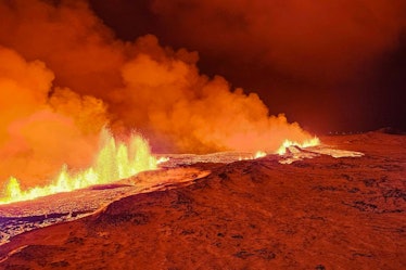 A handout picture provided by Iceland Civil Defense shows a volcanic eruption north of Grindavik, Ic...