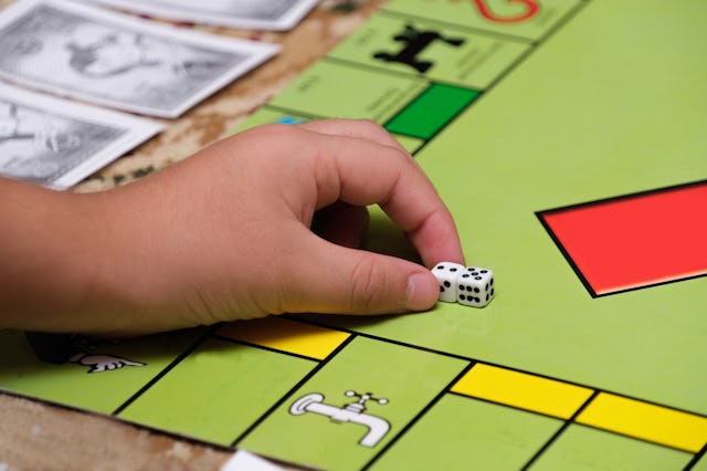 Game monopoly, game chips and dice on the table