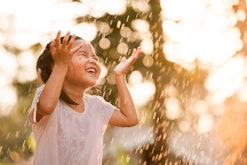 Child playing in the rain; names that mean water often refer to rainfall.