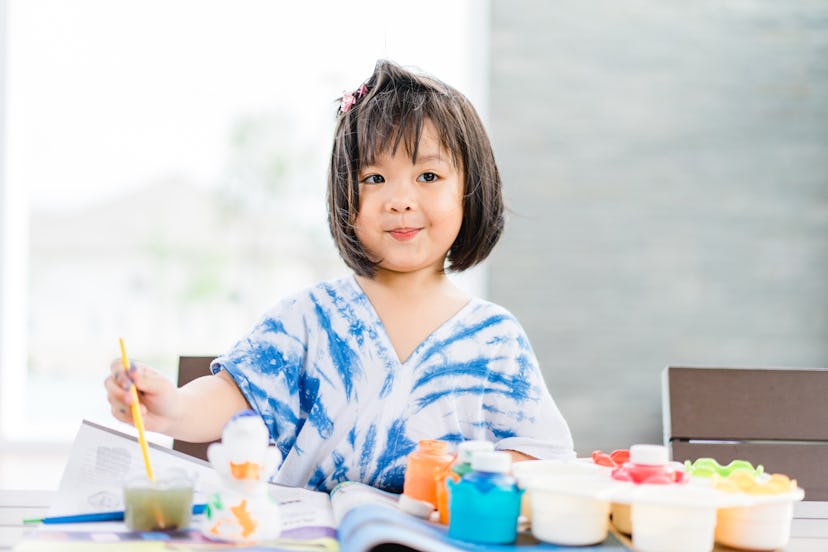 A little girl paints. Many 4 letter girl names are unique in the United States.