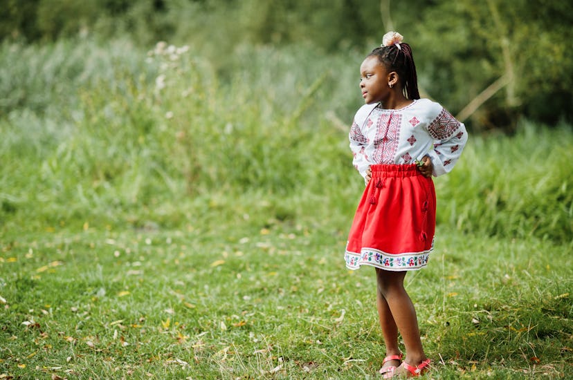 A little girl in a park in a story about March baby names.