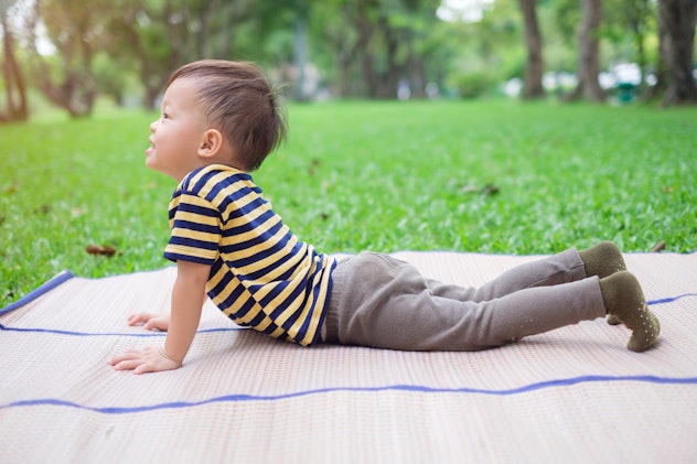 Child practices yoga in the park. One syllable boy names are becoming increasingly popular.