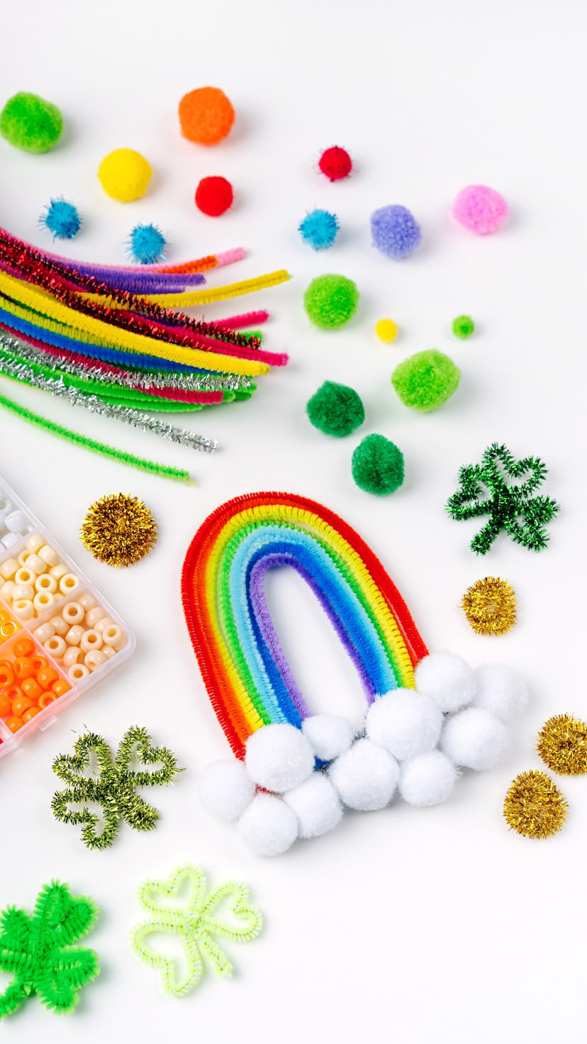Rainbow and clover made of beads and pipe cleaners with different multi-colored  materials for DIY a...