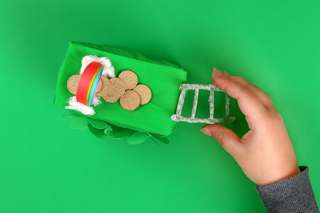 DIY ladder straws cocktail and washi tape St Patricks Day green background. Gift Idea, decor for lep...