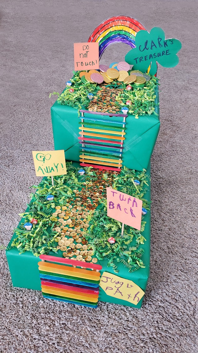 Colorful DIY Leprechaun Trap made by a child and Mom for a school project with, rainbow, ladder, pat...