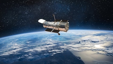 Hubble space telescope on orbit of Earth planet. Space observatory research. Elements of this image ...
