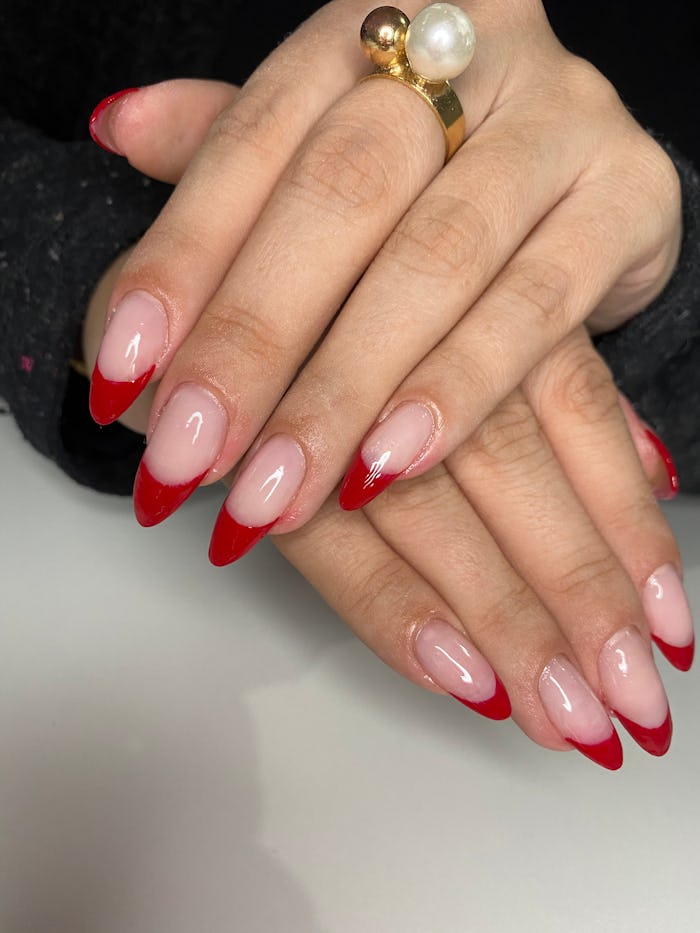 French manicure done in red, a perfect Aries nail design