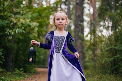 A little girl dressed as a princess in the woods. Igraine is a unique baby name from Arthurian legen...
